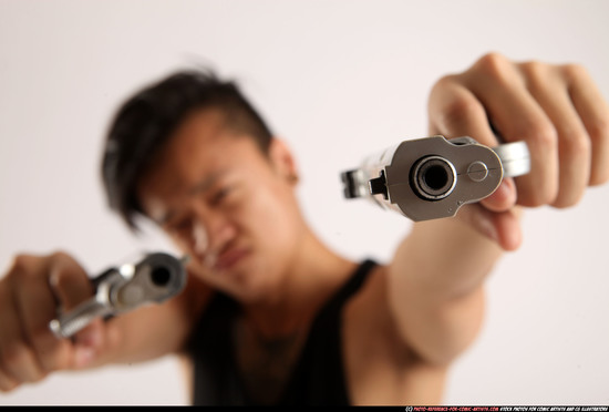 Man Young Athletic Fighting with gun Standing poses Casual Asian