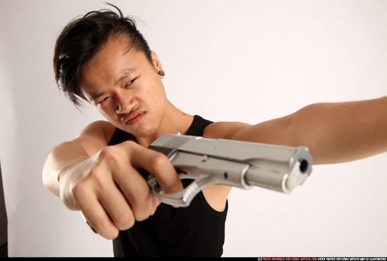 Man Young Athletic Fighting with gun Standing poses Casual Asian