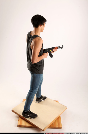 Man Young Athletic Fighting with submachine gun Standing poses Casual Asian