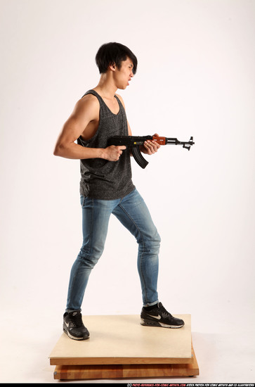 Man Young Athletic Fighting with submachine gun Standing poses Casual Asian