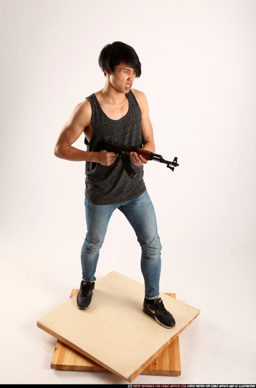 Man Young Athletic Fighting with submachine gun Standing poses Casual Asian