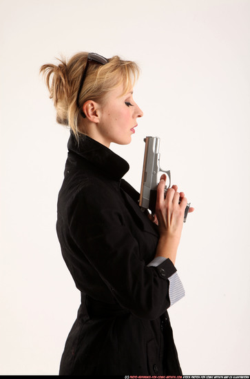 Woman Adult Athletic White Fighting with gun Standing poses Coat