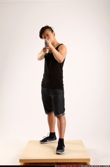 Man Young Athletic Fighting with submachine gun Standing poses Casual Asian