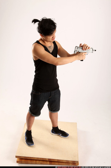 Man Young Athletic Fighting with submachine gun Standing poses Casual Asian