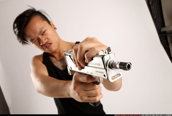 Man Young Athletic Fighting with submachine gun Standing poses Casual Asian