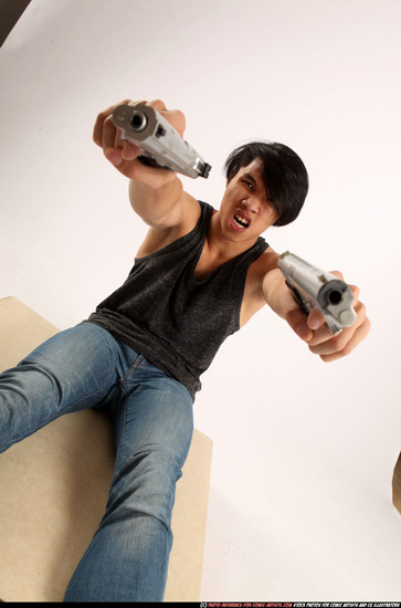 Man Young Athletic Fighting with gun Sitting poses Casual Latino