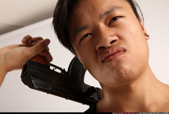 Man Young Athletic Fighting with submachine gun Standing poses Casual Asian