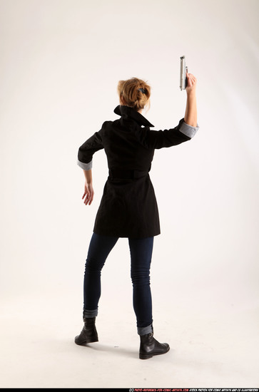 Woman Adult Athletic White Fighting with gun Standing poses Coat