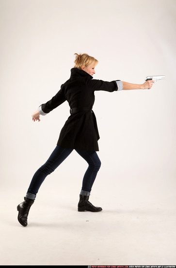 Woman Adult Athletic White Fighting with gun Standing poses Coat