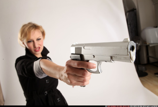 Woman Adult Athletic White Fighting with gun Standing poses Coat