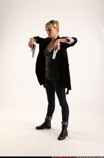 Woman Adult Athletic White Fighting with gun Standing poses Coat