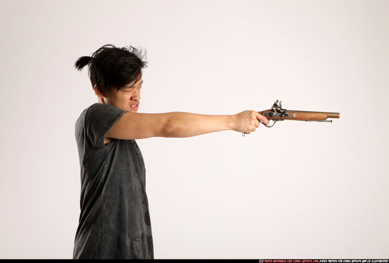 Man Young Athletic Fighting with gun Standing poses Casual Asian