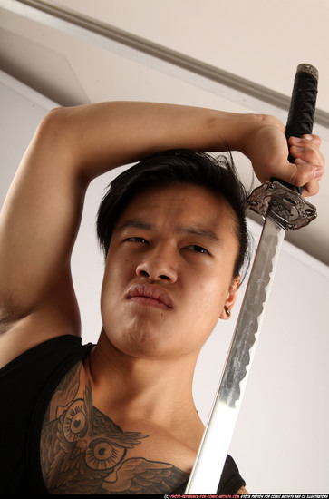 Man Young Athletic Fighting with sword Standing poses Casual Asian