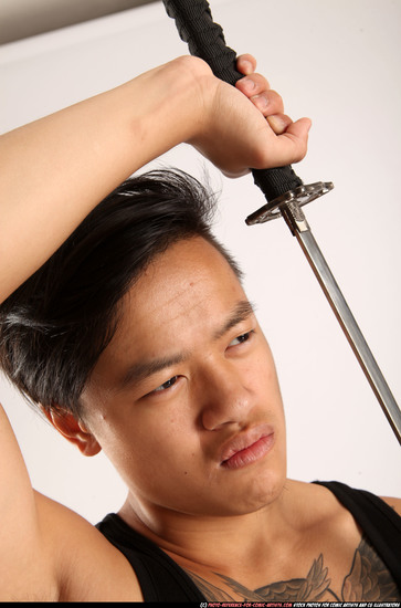 Man Young Athletic Fighting with sword Standing poses Casual Asian