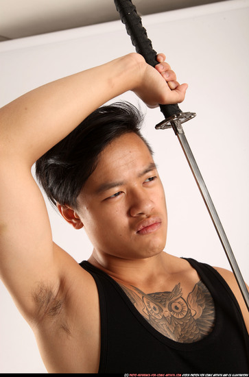 Man Young Athletic Fighting with sword Standing poses Casual Asian