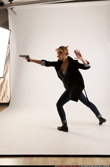 Woman Adult Athletic White Fighting with gun Standing poses Coat