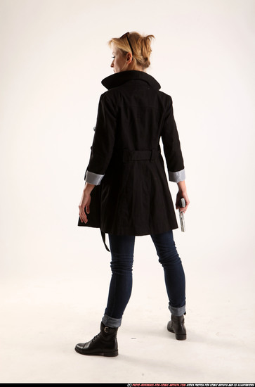 Woman Adult Athletic White Fighting with gun Standing poses Coat