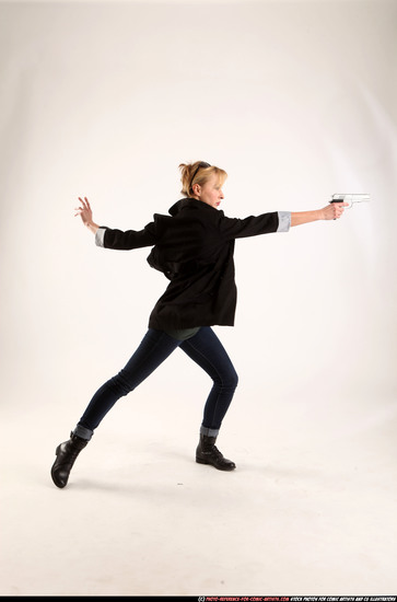 Woman Adult Athletic White Fighting with gun Standing poses Coat