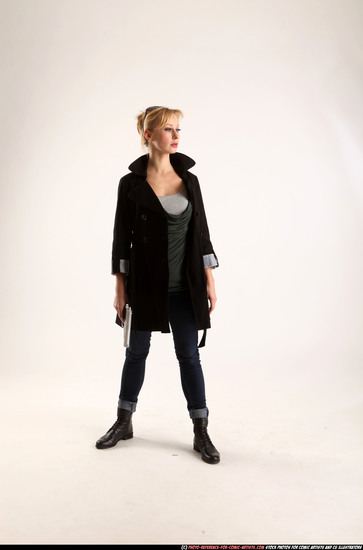 Woman Adult Athletic White Fighting with gun Standing poses Coat