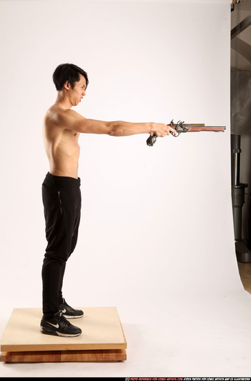 Man Young Athletic Fighting with gun Standing poses Pants Asian