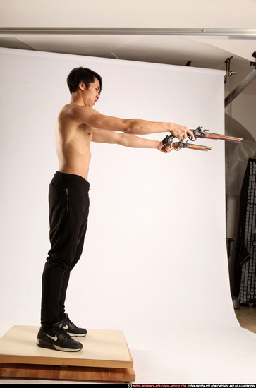 Man Young Athletic Fighting with gun Standing poses Pants Asian