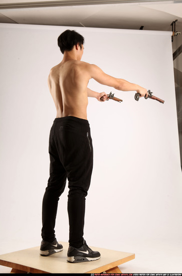 Man Young Athletic Fighting with gun Standing poses Pants Asian