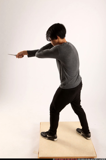 Man Young Athletic Fighting with knife Standing poses Casual Asian