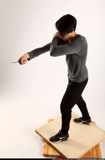 Man Young Athletic Fighting with knife Standing poses Casual Asian