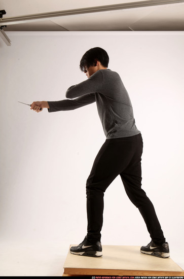 Man Young Athletic Fighting with knife Standing poses Casual Asian