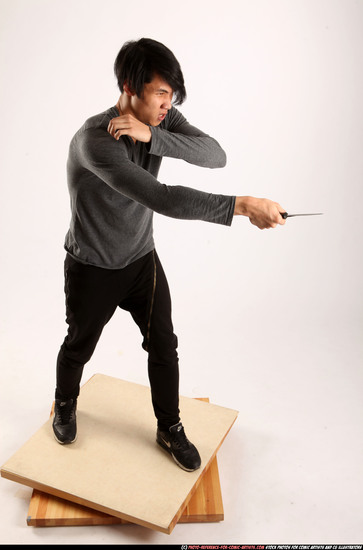 Man Young Athletic Fighting with knife Standing poses Casual Asian