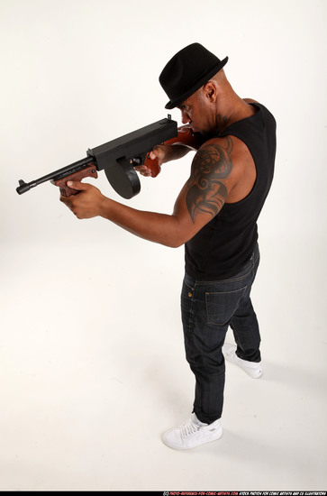 Man Adult Athletic Black Fighting with submachine gun Standing poses Casual