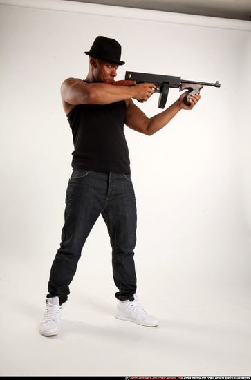 Man Adult Athletic Black Fighting with submachine gun Standing poses Casual