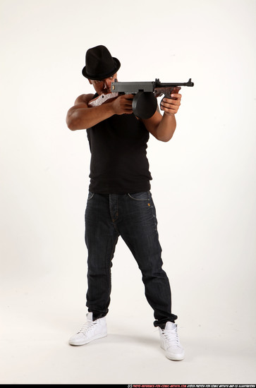 Man Adult Athletic Black Fighting with submachine gun Standing poses Casual