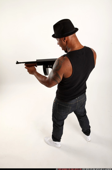 Man Adult Athletic Black Fighting with submachine gun Standing poses Casual