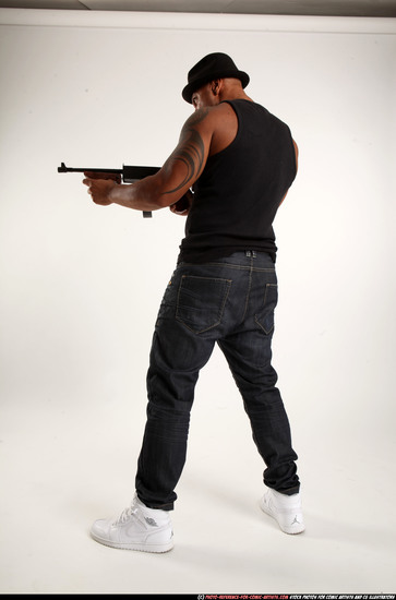 Man Adult Athletic Black Fighting with submachine gun Standing poses Casual