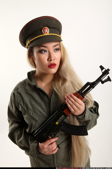 Woman Young Average Fighting with submachine gun Standing poses Army Asian