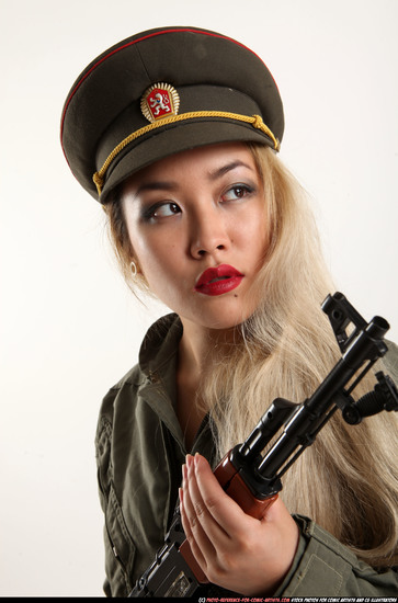 Woman Young Average Fighting with submachine gun Standing poses Army Asian