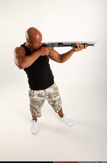 Man Adult Athletic Black Standing poses Sportswear Fighting with shotgun