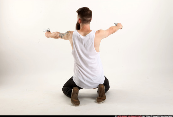 Man Adult Athletic White Fighting with gun Kneeling poses Casual