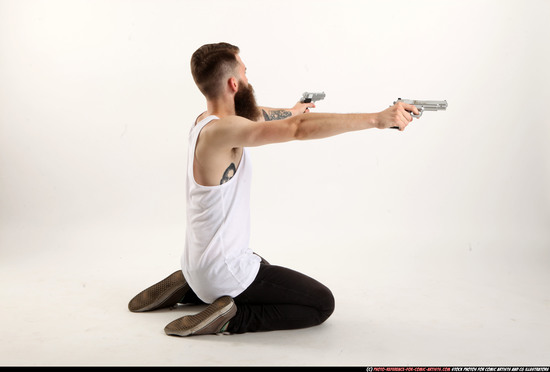 Man Adult Athletic White Fighting with gun Kneeling poses Casual