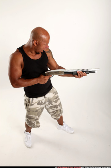 Man Adult Athletic Black Standing poses Sportswear Fighting with shotgun