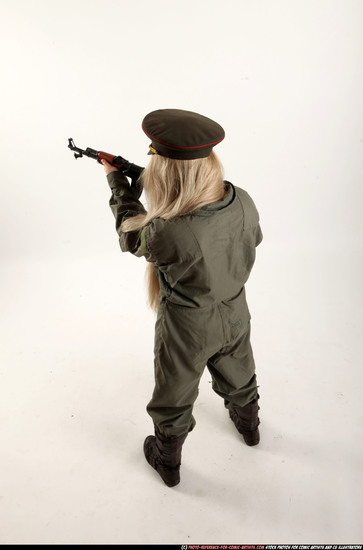 Woman Young Average Fighting with submachine gun Standing poses Army Asian