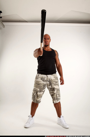 Man Adult Athletic Black Standing poses Sportswear Fighting with bat