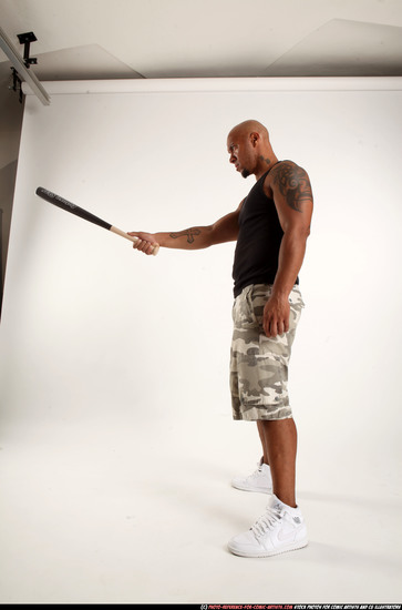 Man Adult Athletic Black Standing poses Sportswear Fighting with bat