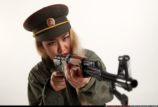 Woman Young Average Fighting with submachine gun Kneeling poses Army Asian