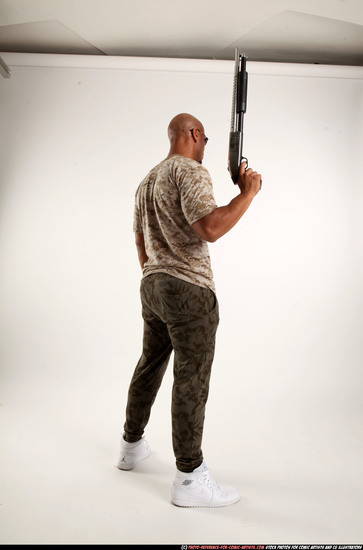 Man Adult Athletic Black Standing poses Army Fighting with shotgun