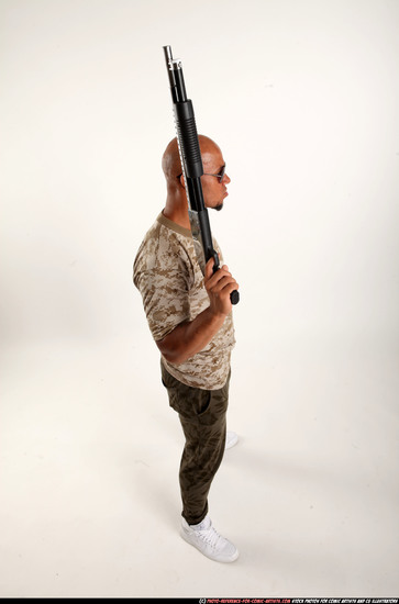 Man Adult Athletic Black Standing poses Army Fighting with shotgun