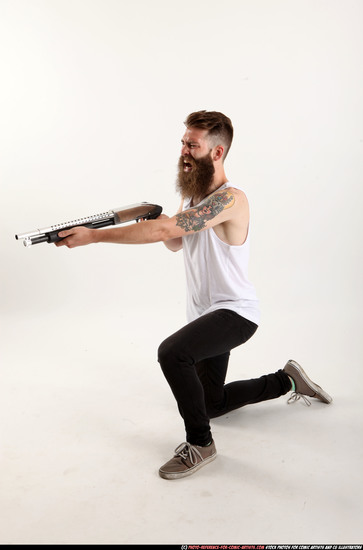 Man Adult Athletic White Kneeling poses Casual Fighting with shotgun