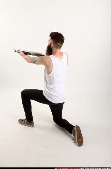 Man Adult Athletic White Kneeling poses Casual Fighting with shotgun