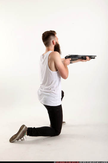 Man Adult Athletic White Kneeling poses Casual Fighting with shotgun